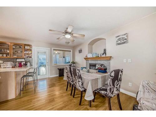 128 Taralake Terrace Ne, Calgary, AB - Indoor Photo Showing Dining Room With Fireplace