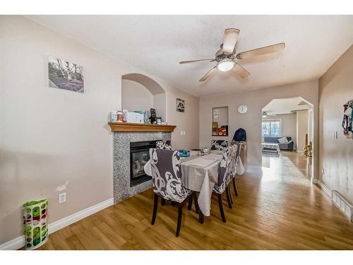 128 Taralake Terrace Ne, Calgary, AB - Indoor Photo Showing Dining Room With Fireplace