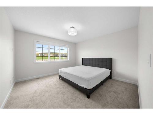 921 Bayview Heights Sw, Airdrie, AB - Indoor Photo Showing Bedroom