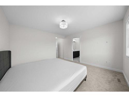 921 Bayview Heights Sw, Airdrie, AB - Indoor Photo Showing Bedroom