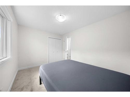 921 Bayview Heights Sw, Airdrie, AB - Indoor Photo Showing Bedroom