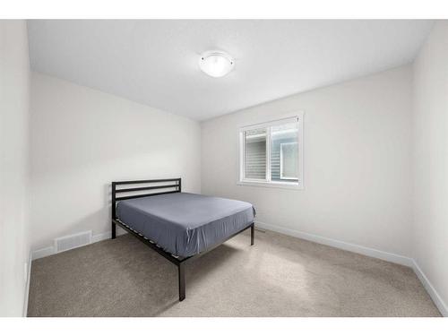 921 Bayview Heights Sw, Airdrie, AB - Indoor Photo Showing Bedroom