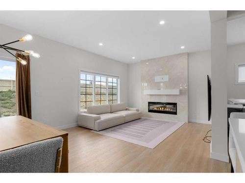 921 Bayview Heights Sw, Airdrie, AB - Indoor Photo Showing Living Room With Fireplace