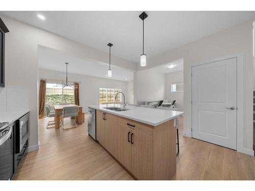 921 Bayview Heights Sw, Airdrie, AB - Indoor Photo Showing Kitchen With Double Sink With Upgraded Kitchen