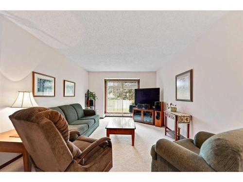 240 Doverglen Place Se, Calgary, AB - Indoor Photo Showing Living Room