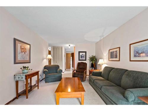 240 Doverglen Place Se, Calgary, AB - Indoor Photo Showing Living Room