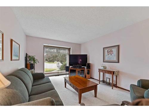 240 Doverglen Place Se, Calgary, AB - Indoor Photo Showing Living Room