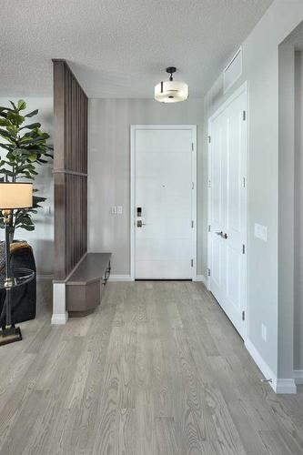 201-190 Marina Cove Se, Calgary, AB - Indoor Photo Showing Other Room