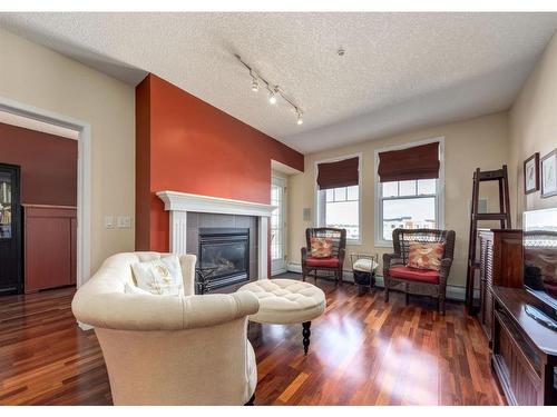 5204-14645 6 Street Sw, Calgary, AB - Indoor Photo Showing Living Room With Fireplace