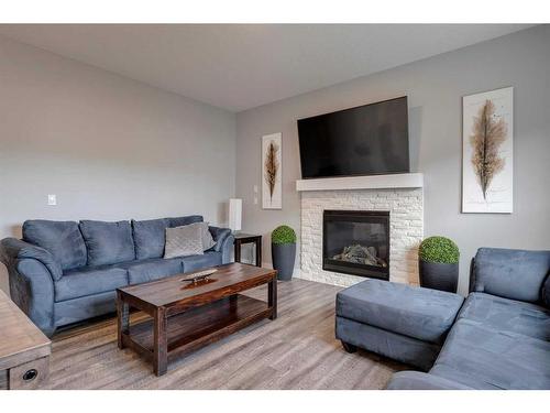 1360 Lackner Boulevard, Carstairs, AB - Indoor Photo Showing Living Room With Fireplace