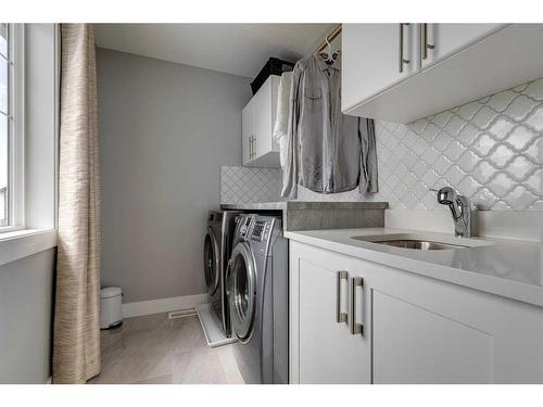 1360 Lackner Boulevard, Carstairs, AB - Indoor Photo Showing Laundry Room