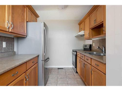 148 Silin Forest Road, Fort Mcmurray, AB - Indoor Photo Showing Kitchen With Double Sink