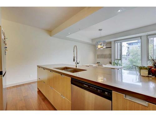 404-2905 16 Street Sw, Calgary, AB - Indoor Photo Showing Kitchen With Double Sink With Upgraded Kitchen