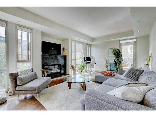 404-2905 16 Street Sw, Calgary, AB - Indoor Photo Showing Living Room With Fireplace