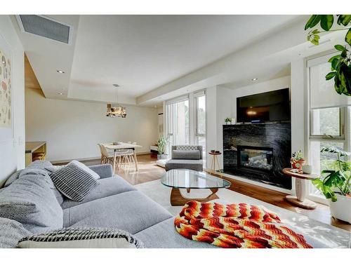 404-2905 16 Street Sw, Calgary, AB - Indoor Photo Showing Living Room With Fireplace