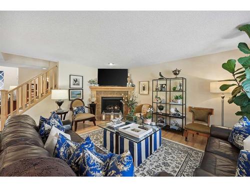 55 Everbrook Link Sw, Calgary, AB - Indoor Photo Showing Living Room With Fireplace