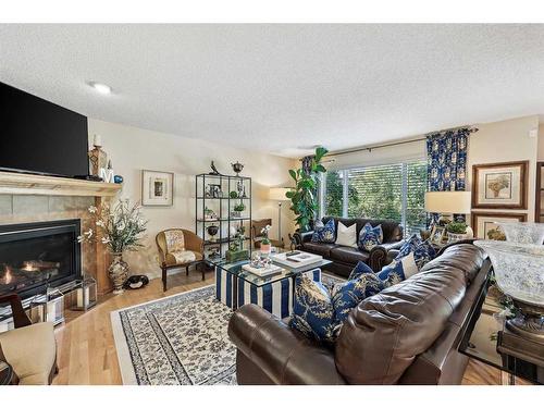 55 Everbrook Link Sw, Calgary, AB - Indoor Photo Showing Living Room With Fireplace