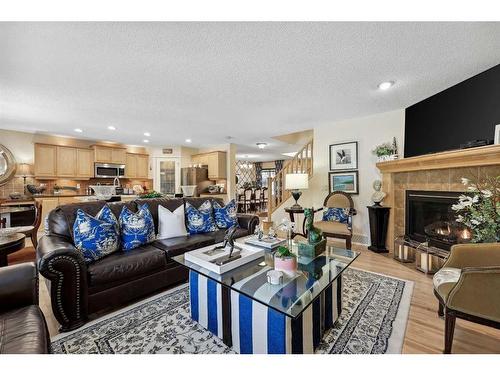 55 Everbrook Link Sw, Calgary, AB - Indoor Photo Showing Living Room With Fireplace