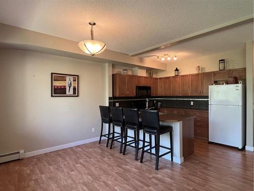 1215-211 Aspen Stone Boulevard Sw, Calgary, AB - Indoor Photo Showing Kitchen