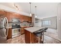 204-11 Millrise Drive Sw, Calgary, AB  - Indoor Photo Showing Kitchen With Stainless Steel Kitchen With Upgraded Kitchen 