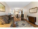 41-72 Millside Drive Sw, Calgary, AB  - Indoor Photo Showing Living Room 