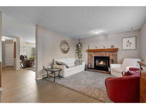 217 Riverwood Close Se, Calgary, AB - Indoor Photo Showing Living Room With Fireplace