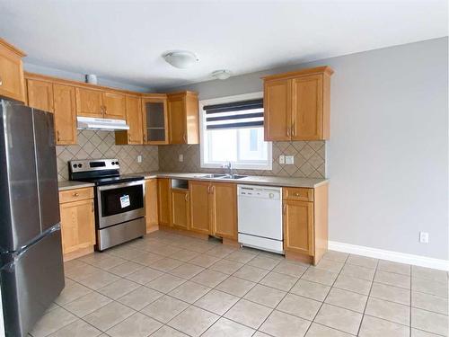 109 Sierra Place, Olds, AB - Indoor Photo Showing Kitchen With Double Sink