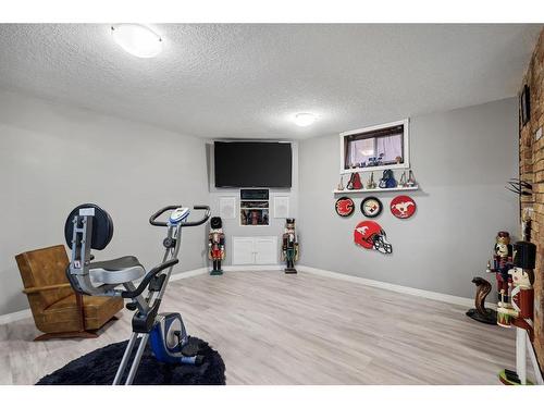 3216 39 Street Se, Calgary, AB - Indoor Photo Showing Gym Room