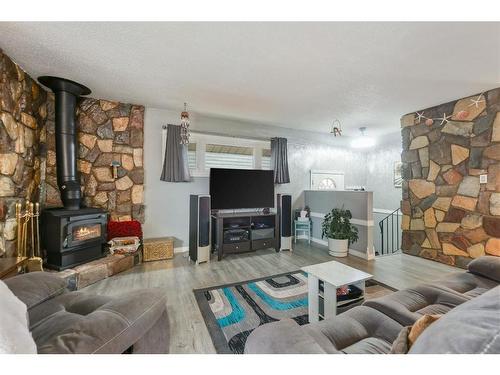 3216 39 Street Se, Calgary, AB - Indoor Photo Showing Living Room With Fireplace