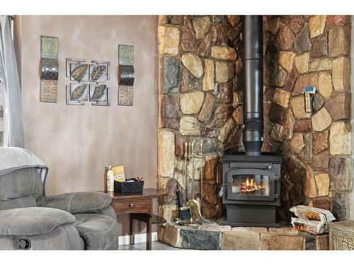 3216 39 Street Se, Calgary, AB - Indoor Photo Showing Living Room With Fireplace