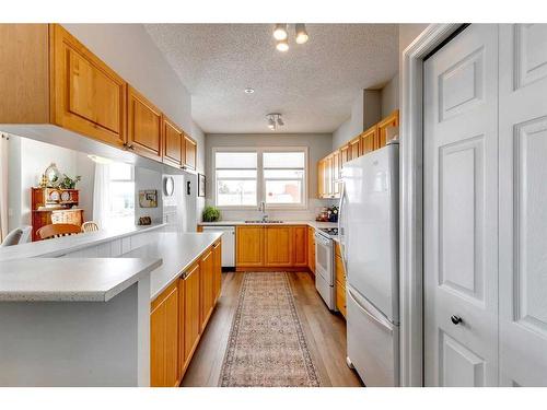 1312-1010 Arbour Lake Road Nw, Calgary, AB - Indoor Photo Showing Kitchen With Double Sink