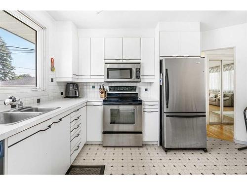 62 Westwood Drive Sw, Calgary, AB - Indoor Photo Showing Kitchen With Double Sink