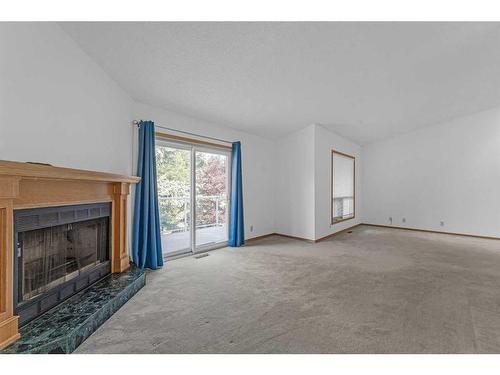 140 Prominence Heights Sw, Calgary, AB - Indoor With Fireplace