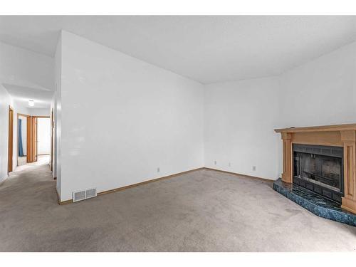 140 Prominence Heights Sw, Calgary, AB - Indoor With Fireplace