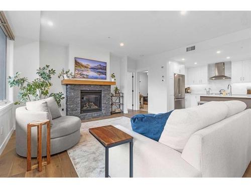 209-1315 Spring Creek Gate, Canmore, AB - Indoor Photo Showing Living Room With Fireplace