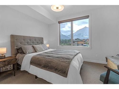 209-1315 Spring Creek Gate, Canmore, AB - Indoor Photo Showing Bedroom