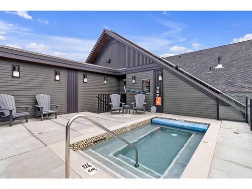 209-1315 Spring Creek Gate, Canmore, AB - Outdoor With In Ground Pool With Deck Patio Veranda With Exterior