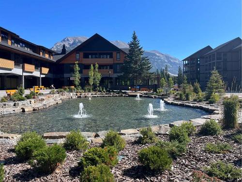 209-1315 Spring Creek Gate, Canmore, AB - Outdoor With Body Of Water