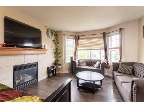 84 Saddlemont Road Ne, Calgary, AB - Indoor Photo Showing Living Room With Fireplace