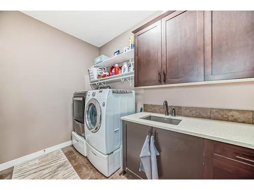 209 Kinniburgh Boulevard, Chestermere, AB - Indoor Photo Showing Laundry Room