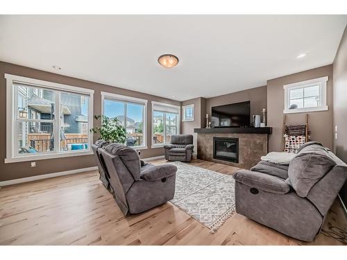 209 Kinniburgh Boulevard, Chestermere, AB - Indoor Photo Showing Living Room With Fireplace