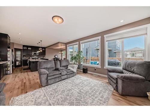 209 Kinniburgh Boulevard, Chestermere, AB - Indoor Photo Showing Living Room