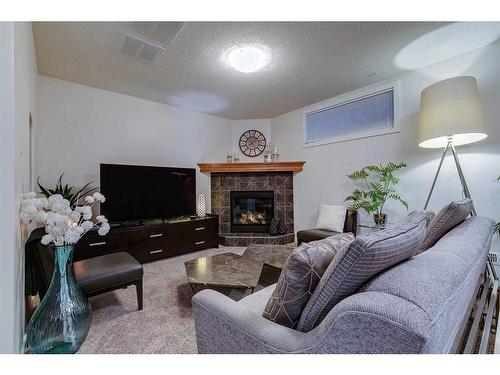 39 Cranridge Crescent Se, Calgary, AB - Indoor Photo Showing Living Room With Fireplace