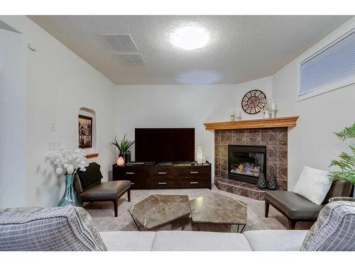 39 Cranridge Crescent Se, Calgary, AB - Indoor Photo Showing Living Room With Fireplace