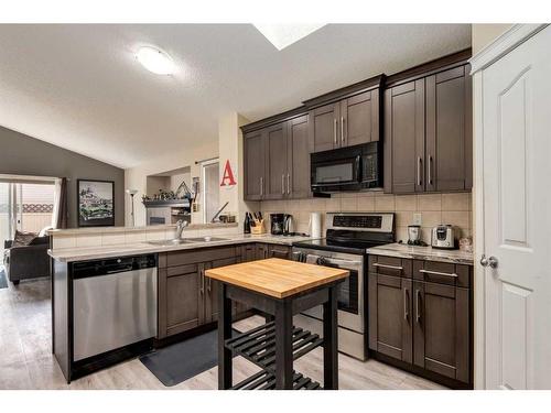 15 Cramond Circle Se, Calgary, AB - Indoor Photo Showing Kitchen With Double Sink