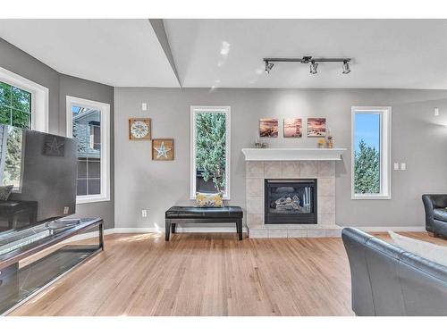 213 West Lakeview Place, Chestermere, AB - Indoor Photo Showing Living Room With Fireplace