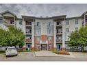 205-8 Country Village Bay Ne, Calgary, AB  - Outdoor With Balcony With Facade 