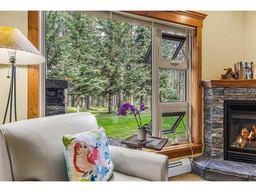 112-175 Crossbow Place, Canmore, AB - Indoor Photo Showing Living Room With Fireplace