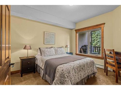 112-175 Crossbow Place, Canmore, AB - Indoor Photo Showing Bedroom