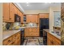 112-175 Crossbow Place, Canmore, AB  - Indoor Photo Showing Kitchen With Double Sink 